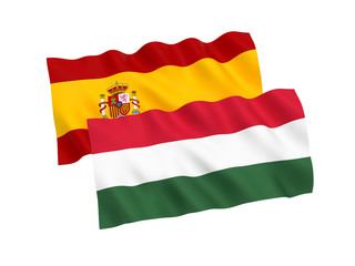 National fabric flags of Hungary and Spain isolated on white background. 3d rendering illustration. 1 to 2 proportion.