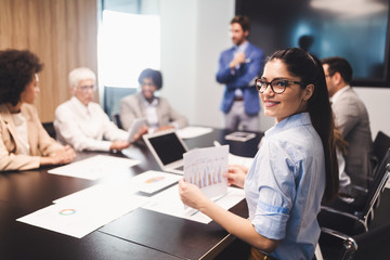 Happy business colleagues in modern office working together