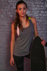 young beautiful girl keep longboard