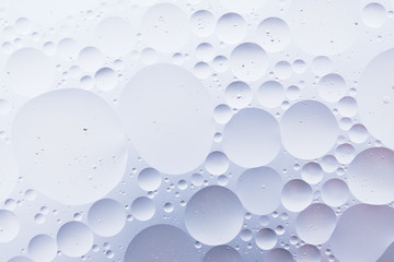 Water oil bubble macro abstract background flow liquid blue white aqua colors
