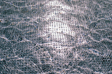 Waves and reflections of the surface and bottom of a pool