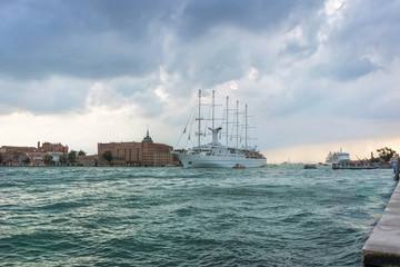 Fototapeta na wymiar Cruise liner is leaving Venice harbor