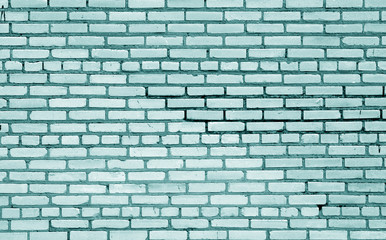 Old brick wall surface in cyan tone.