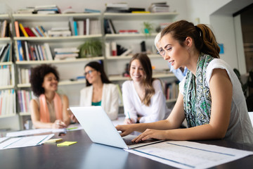 Cheerful coworkers in office during company meeting