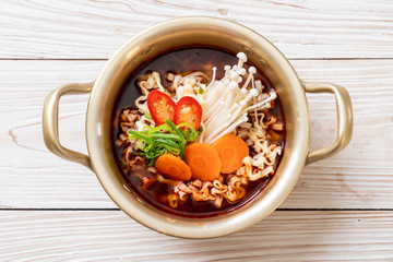 korean instant noodles in golden pot