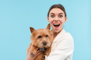 Cheerful young woman standing isolated