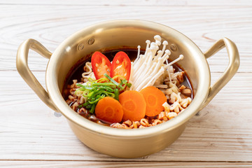 korean instant noodles in golden pot