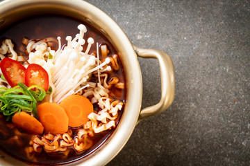 korean instant noodles in golden pot