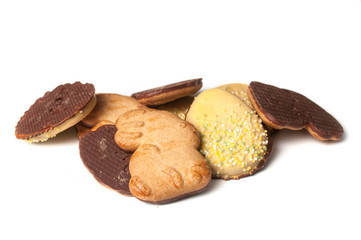 group of easter chocolate biscuits in shaped rabbits and eggs on white background