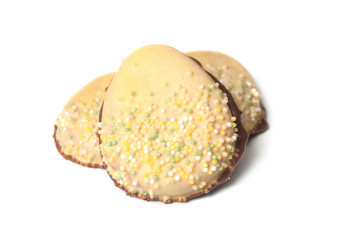 closeup of easter chocolate biscuits in shaped eggs on white background