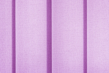 Fototapeta premium Pink blinds vertical blinds in full screen. Close-up of textile surface texture