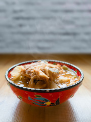 Sour soup with fish and mixed veggies in Turkish design bowl, Thai food. 