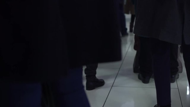 People standing in queue waiting airplane boarding, flight delay, poor quality