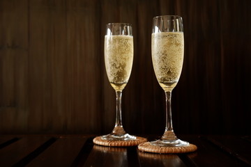 sparkling wine on wood background