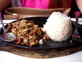 Freshly cooked Sisig on a hot plate