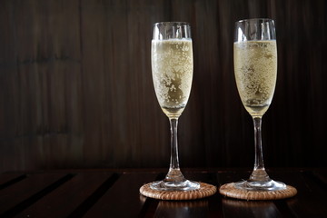 Champagne glass on wooden background