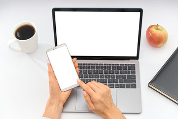 workplace with laptop, notepad, apple and cup of coffee, top view