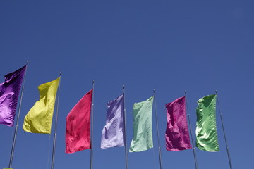 multi colors plain flags on blue sky background