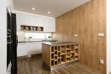 Interior of modern kitchen with built-in appliances