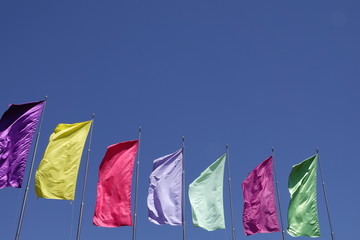 multi colors plain flags on blue sky background
