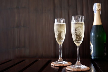 sparkling wine on wood background