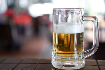glass of beer on wooden table