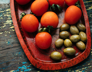 Olives and tomatoes in a vintage bowl