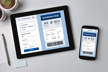 Boarding pass concept on tablet and smartphone screen