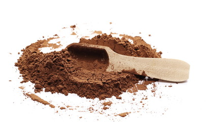 Cocoa powder with wooden spoon isolated on white background