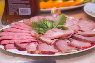  Meat cut in a plate on the festive table