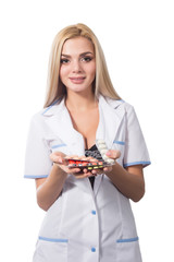 Portrait of happy smiling young female doctor with medical drugs