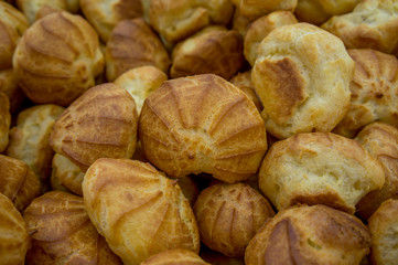 Background color photograph of freshly baked delicious eclairs.