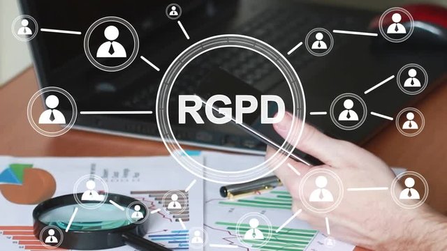 Businessman presses button GDPR general data protection regulation on virtual electronic user interface. Businessman looks at profit chart on phone