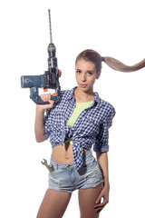 Beautiful  woman with heavy drill in her hands