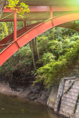 Red metal bridge of Todoroki park in the Setagaya district of Tokyo.