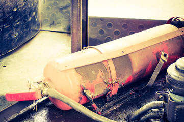 A cylinder with foam. Fire extinguisher in a public transport. 