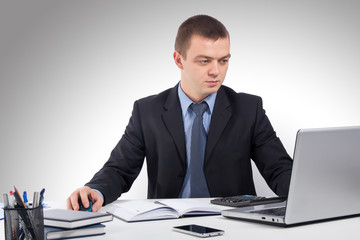 Business man working with documents and laptop