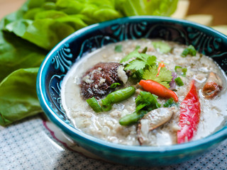 Salted crab stew with coconut milk, minced pork served with vegetables, Thai food.