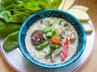Salted crab stew with coconut milk, minced pork served with vegetables, Thai food.