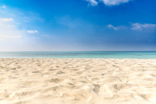Calm beach scene, sand,  sky, sea. Relaxation and inspiration concept