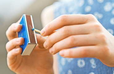 Girl playing with matches. Dangerous situation at home.
