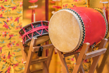 Okinawan traditional music instruments drums taiko on a concert stand with local Ryukyu Island...
