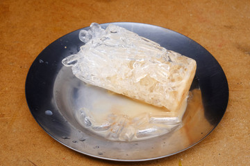 Ice cubes on the plate aluminum