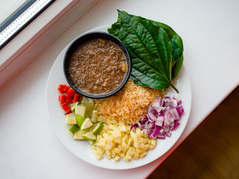 Close up, Close-up Thai-Style Savory Leaf Wraps (Miang Kham) a traditional snack from Thailand and Laos, introduced to Siamese court, Name Miang Kham" translates to "one bite wrap"