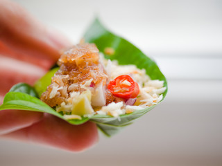 Close up, Close-up Thai-Style Savory Leaf Wraps (Miang Kham) a traditional snack from Thailand and Laos, introduced to Siamese court, Name Miang Kham