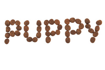 the inscription puppy on a white background from dog food