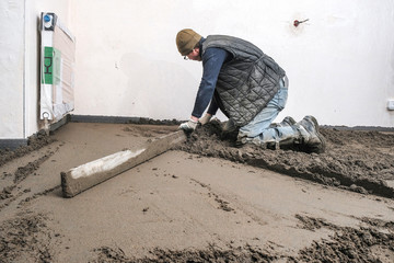 builders poured concrete at the construction site