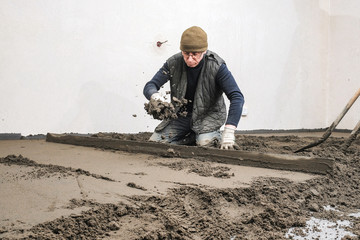 builders poured concrete at the construction site