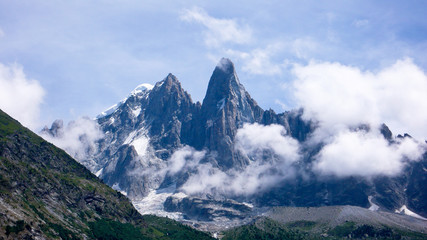 jagged mountain peak landscape with clouds
