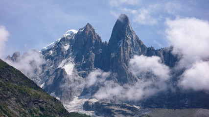 jagged mountain peak landscape with clouds